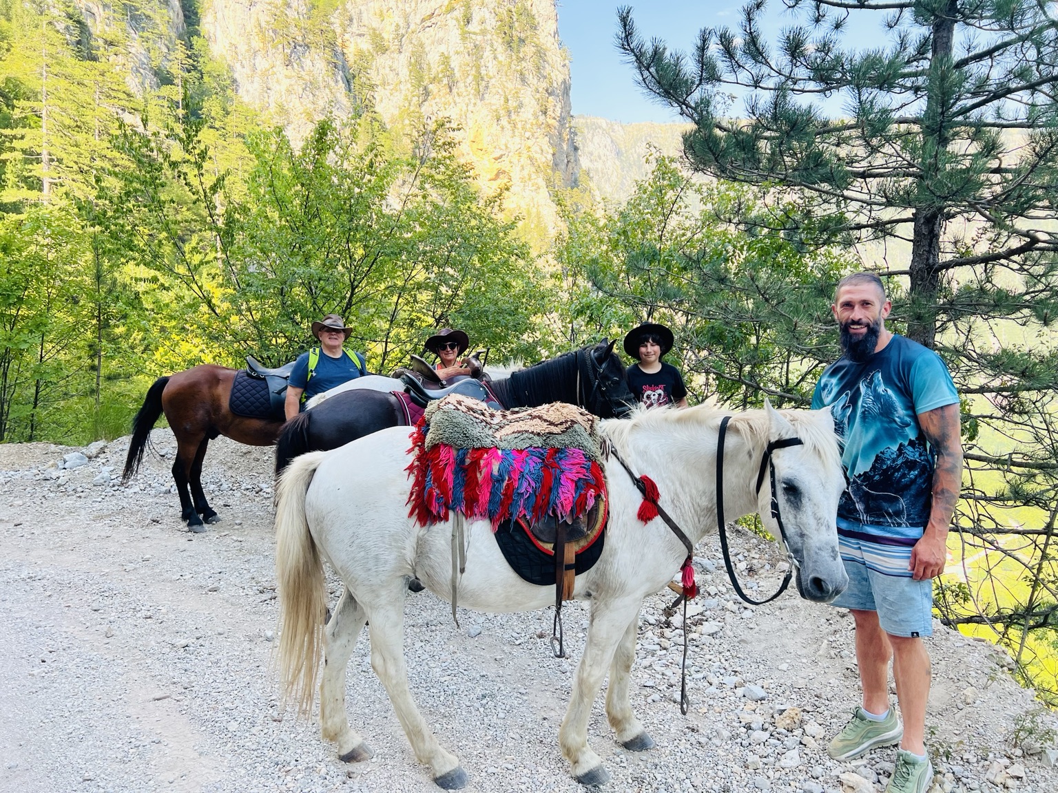 Horse riders on a mountain road