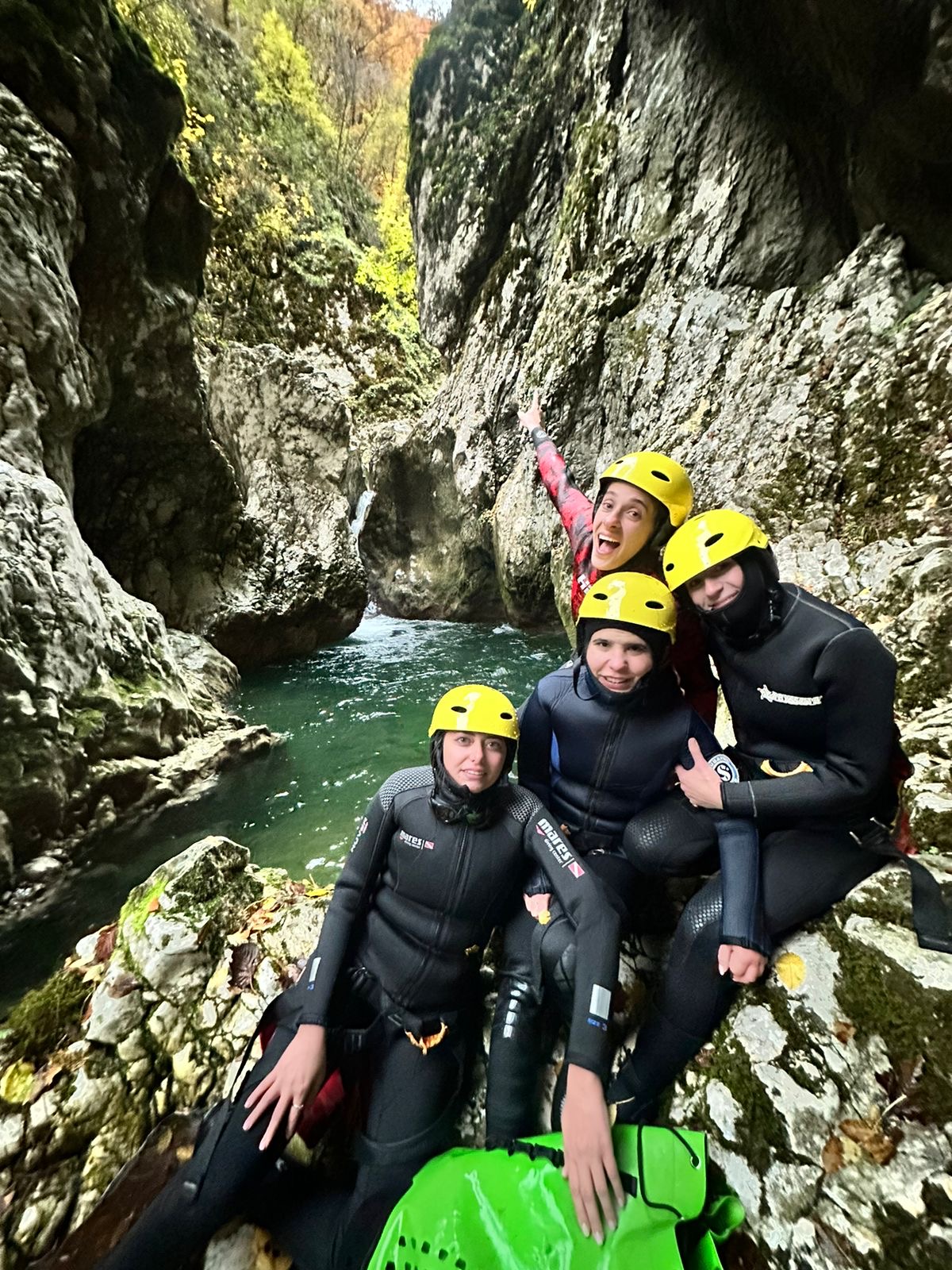 Canyoning group in a narrow river gorge